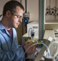 Scientist Tom Metz loads samples into a mass spectrometer at the Environmental Molecular Sciences Laboratory, a DOE national scientific user facility at PNNL.